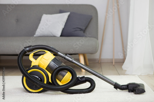 Vacuum cleaner yellow in the interior of the room