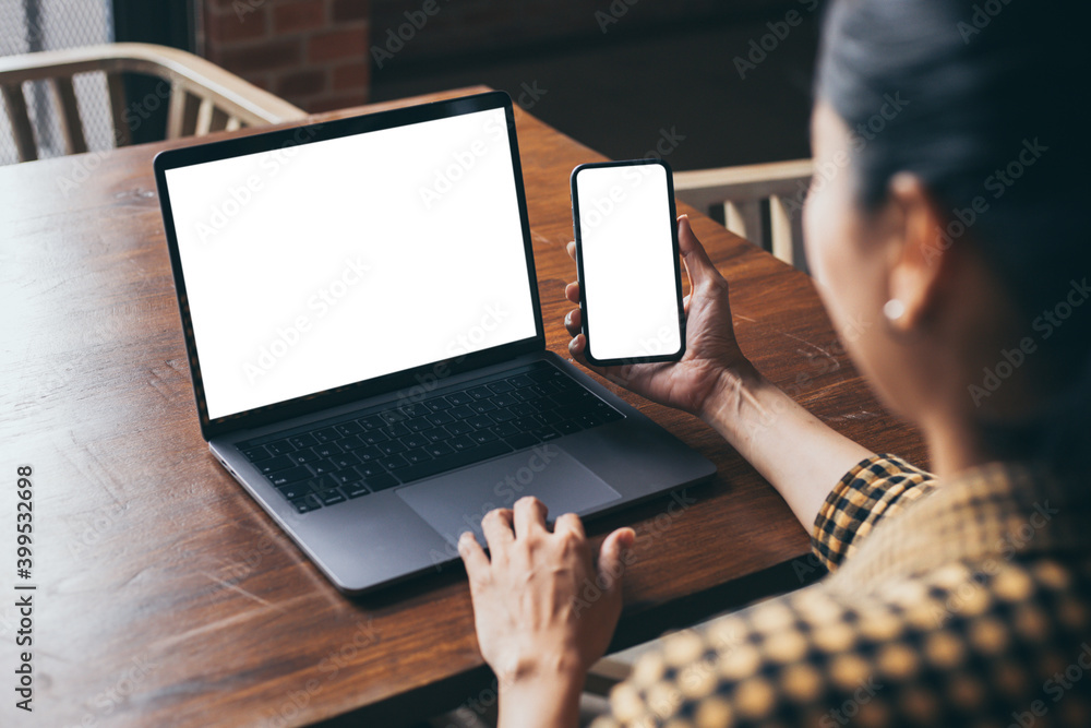 computer screen,cell phone blank mockup.hand woman work using laptop texting mobile. with white background for advertising,contact business search information on desk in cafe.marketing,design computer screen,cell phone blank mockup.hand woman work using laptop texting mobile. with white background for advertising,contact business search information on desk in cafe.marketing,design