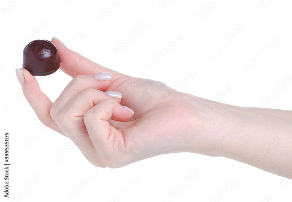 Chocolate candy in hand on white background isolation Chocolate candy in hand on white background isolation