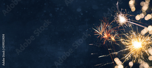 Silvester Festival Party New Year 2024 Fireworks background banner panorama - firework and sparklers on rustic dark blue night sky texture photo
