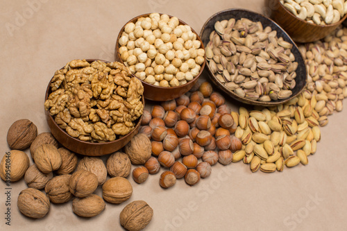 Different types of nuts in composition on white background in studio