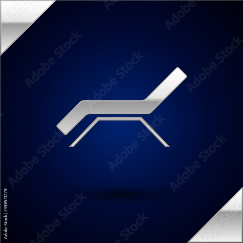 Silver Sunbed icon isolated on dark blue background. Sun lounger. Vector.