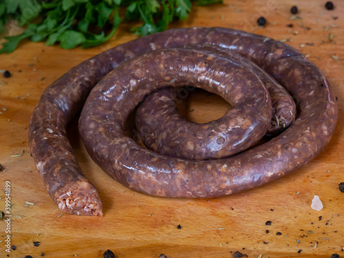 Delicious sausages with spices and greens