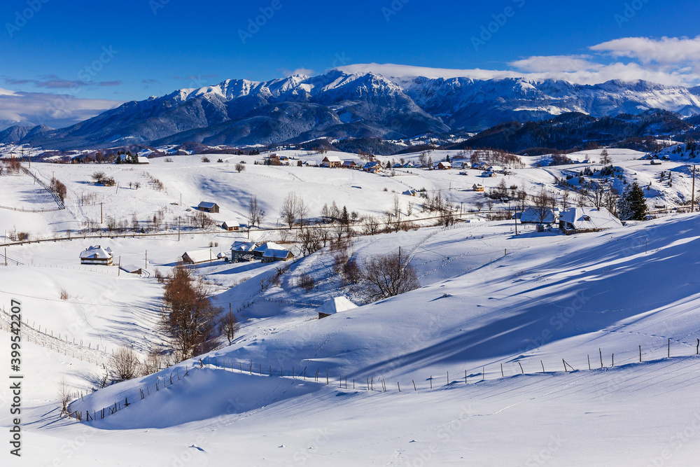 Winter in Pestera Village. Rural landscape in the Carpathians, Romania.