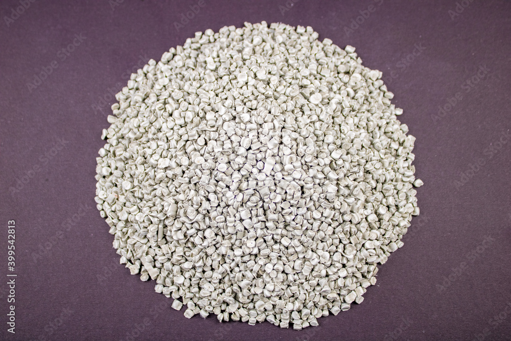 Raw material plastic granules white gray, close-up raw material brown background! Raw material plastic granules white gray, close-up raw material brown background!