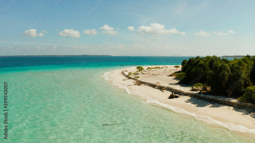 Sandy beach and turquoise water in the blue lagoon, aerial view. Patawan island with sandy beach. Summer and travel vacation concept.