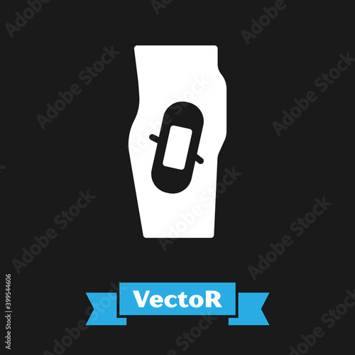 White Plaster on leg icon isolated on black background. Vector.