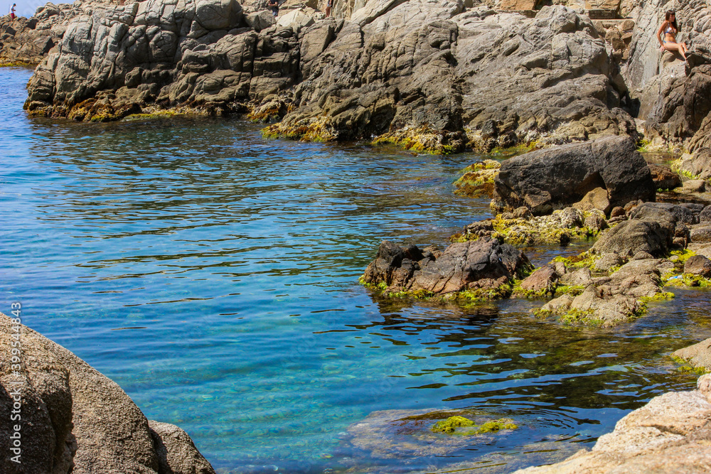 Spain mediterranean sea. A cove surrounded by stones. Spain mediterranean sea. A cove surrounded by stones.