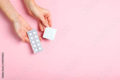 condoms and other contraceptives on a colored background