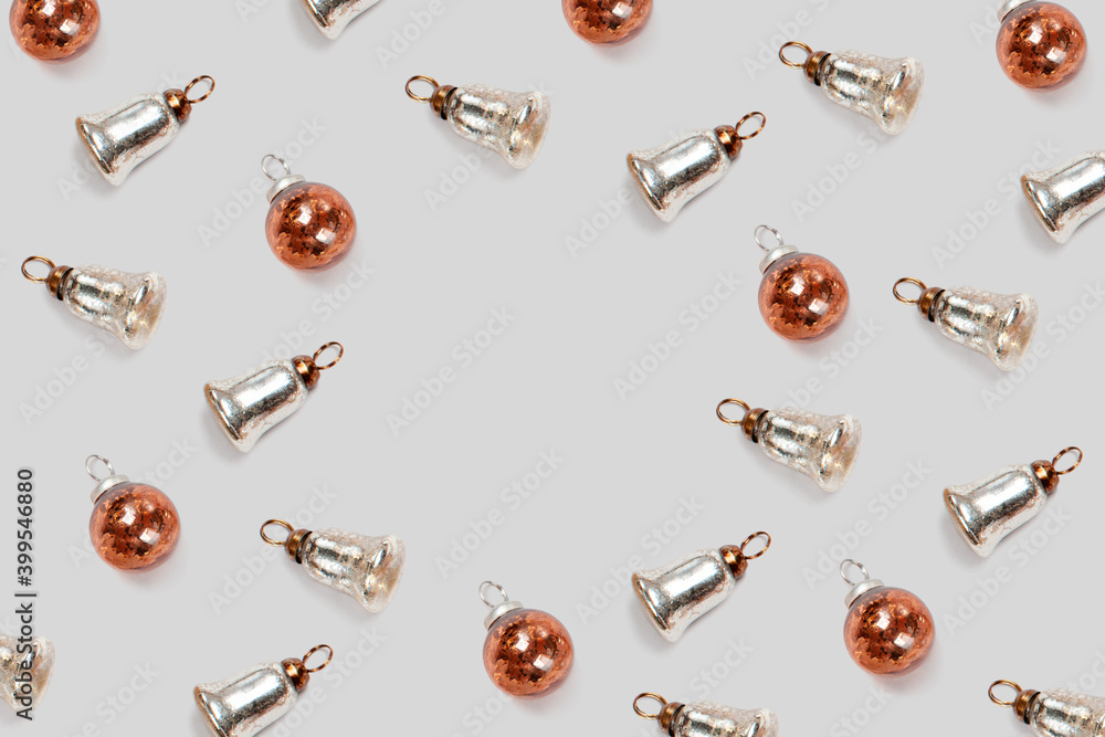 Pattern pattern with christmas tree decorations silver bells on a gray background. Pattern pattern with christmas tree decorations silver bells on a gray background.