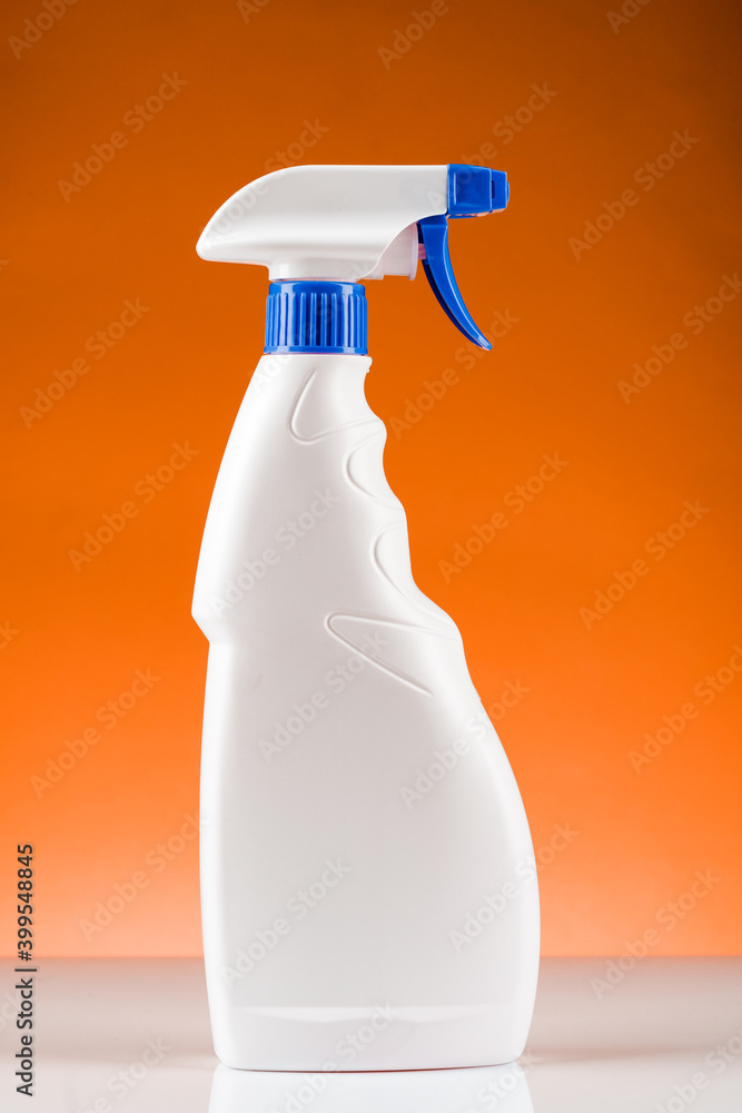 Plastic spray bottle. On yellow background Plastic spray bottle. On yellow background