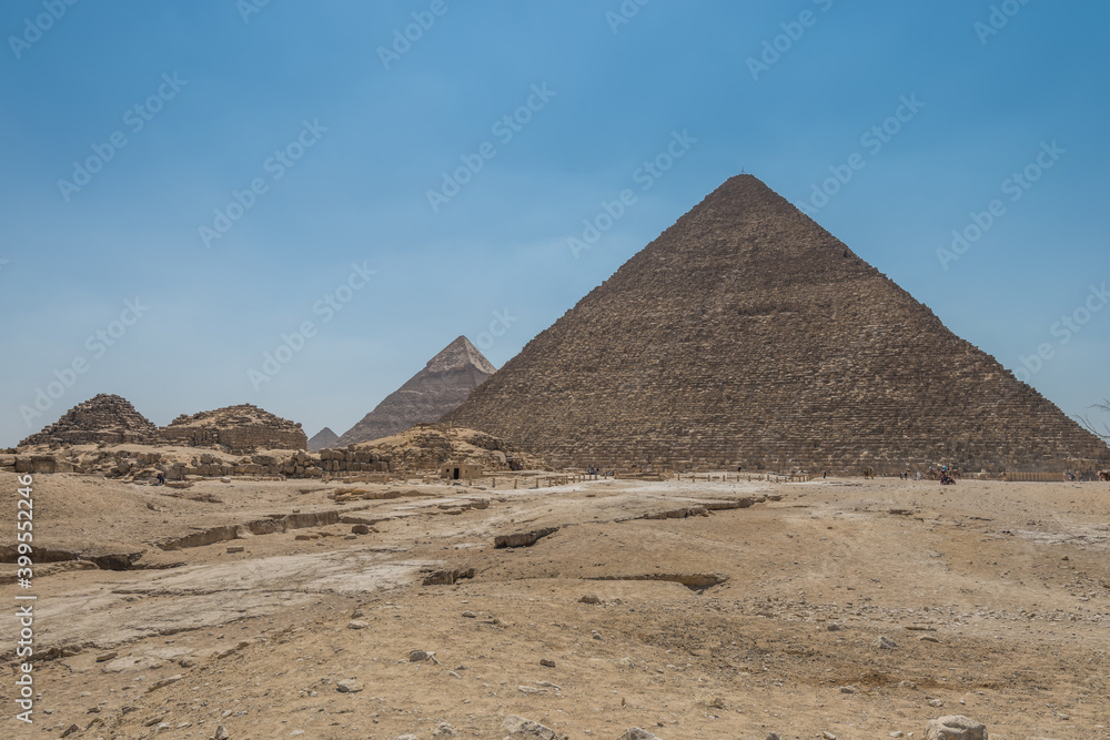 The Giza pyramid complex, an archaeological site on the Giza Plateau, on the outskirts of Cairo, Egypt. It includes the three Great Pyramids : Khufu Cheops, Khafre Chephren and Menkaure. The Giza pyramid complex, an archaeological site on the Giza Plateau, on the outskirts of Cairo, Egypt. It includes the three Great Pyramids : Khufu Cheops, Khafre Chephren and Menkaure.