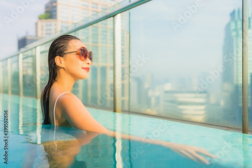 Portrait beautiful young asian woman relax leisure around outdoor swimming pool
