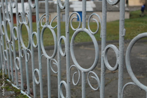 patterned forged fence with circles and curls close-up