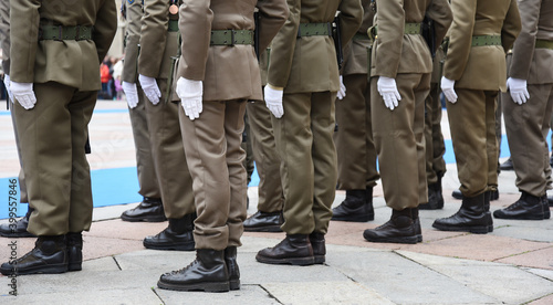 Soldiers lined up in the city square before performing the ceremony - The Army soldiers standing in row they are wearing and wear military uniforms - Concept of patriotism and defense of the nation