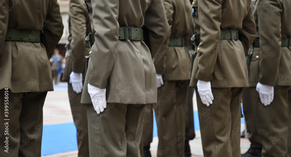 Soldiers lined up in the city square before performing the ceremony - The Army soldiers standing in row they are wearing and wear military uniforms - Concept of patriotism and defense of the nation