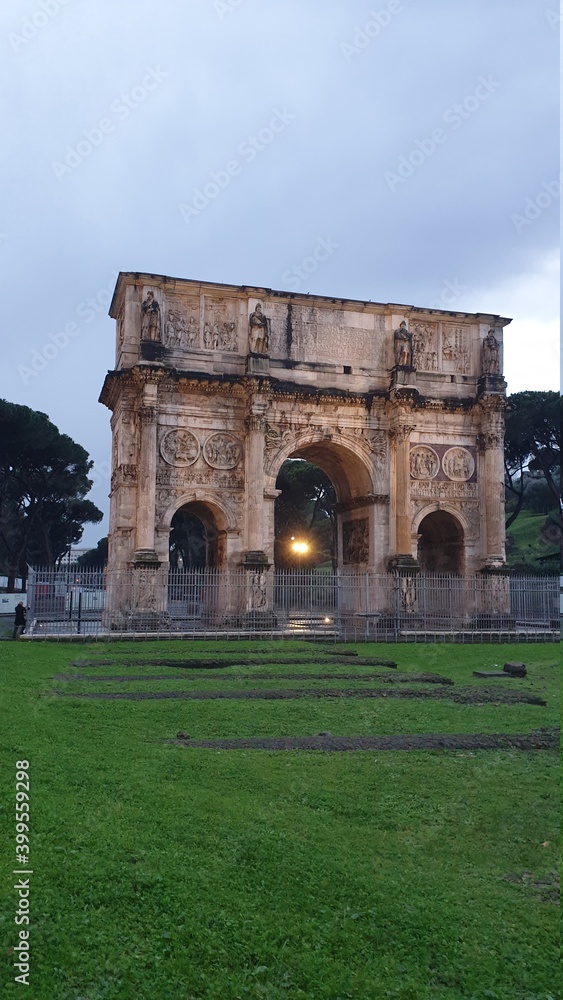 The Arch of Constantine Arco di Costantino. .Triumphal arch and Colosseum on background. Rome