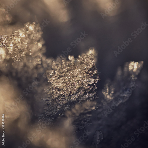 Abstract texture macro image of snow crystals backlit by the sun