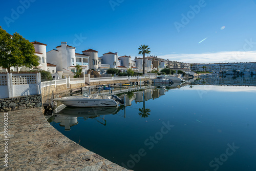 Photography empuriabrava girona view of the canals buildings reflected in the water cataluny