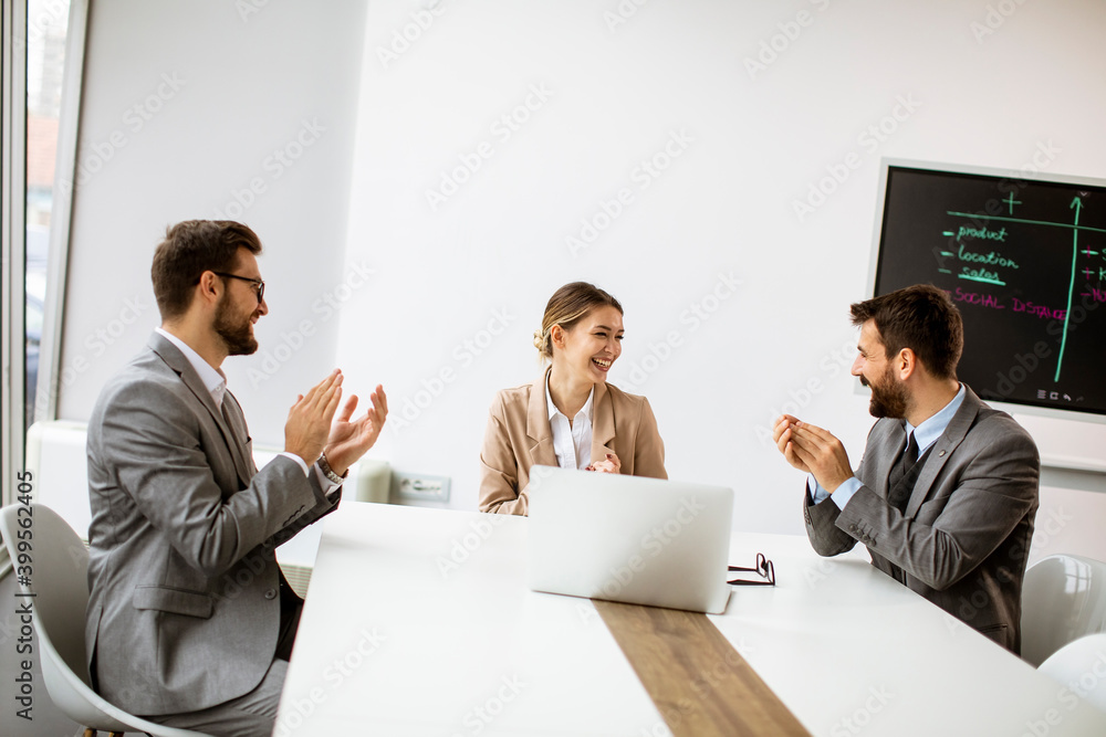 Multiethnic young business people working together in the office Multiethnic young business people working together in the office
