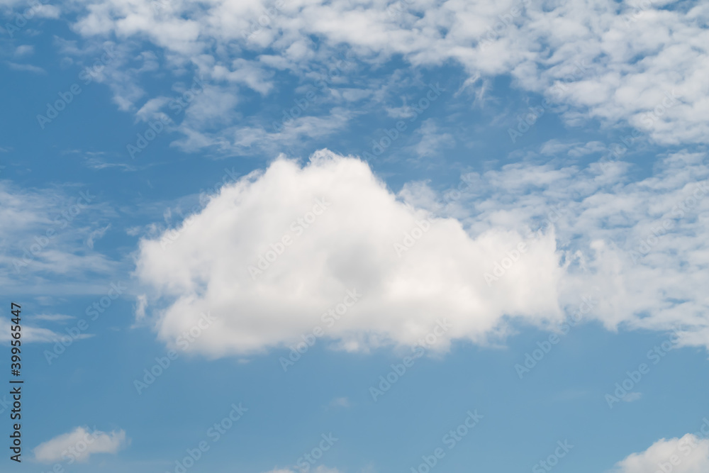 Large Cumulus cloud and Altocumulus clouds against blue sky in sunny day. Large Cumulus cloud and Altocumulus clouds against blue sky in sunny day.