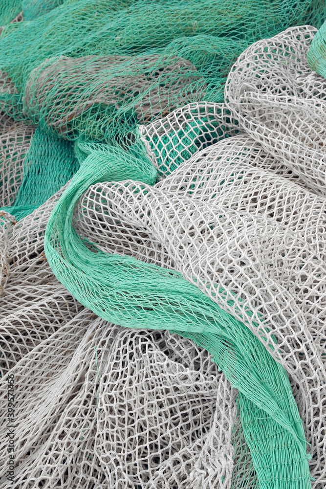 Fishing net is drying in the port. Green fishing net