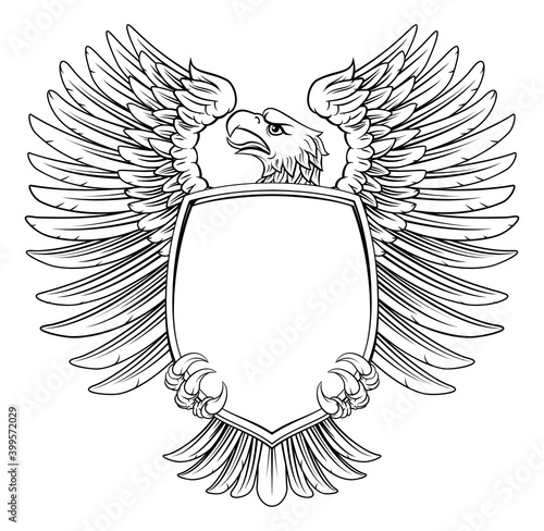 An eagle hawk or flacon shield design element in a vintage engraved woodcut style
