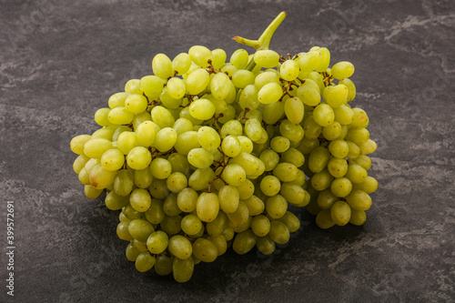 Green grape branch over background