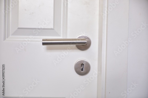 Metal Handle and Keyhole on Wooden Door