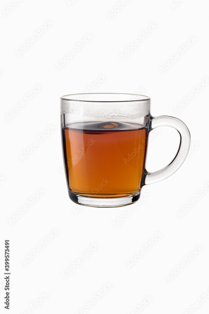 Tea in a transparent glass mug on a white background Tea in a transparent glass mug on a white background