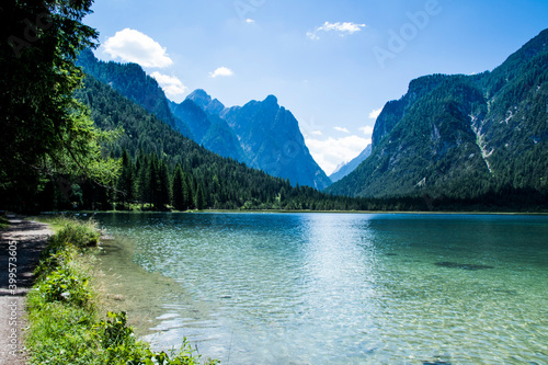 Fototapeta Naklejka Na Ścianę i Meble -  
Dobbiaco Lake, suggestive Alpine scenery in Trentino Alto Adige, crystal clear water with a perfect reflection, suggestive viewpoints