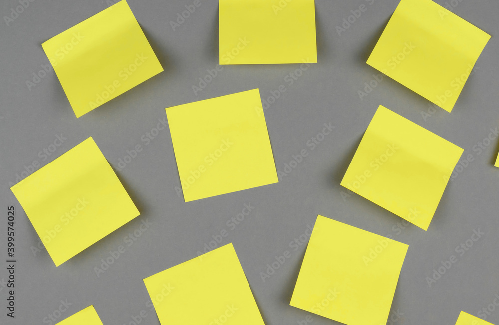 Yellow stickers on a gray background in the trending colors of 2021. Yellow stickers on a gray background in the trending colors of 2021.