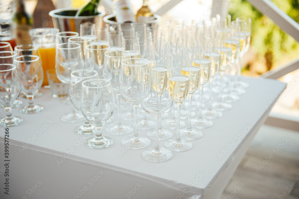 Glasses of champagne at the Banquet, white sparkling wine in wine glasses, festive mood