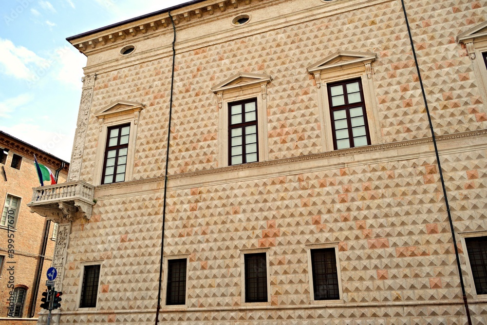 details of the external facade of the Palazzo dei Diamanti in Renaissance style located in the historic center of Ferrara in Italy. Its main feature is the diamond-shaped masonry