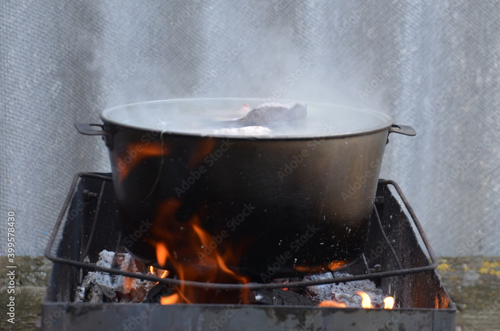 fish soup cooked on fire