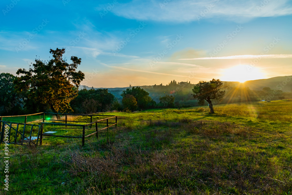 sunset over the Chianti hills of Siena in Tuscany in autumn