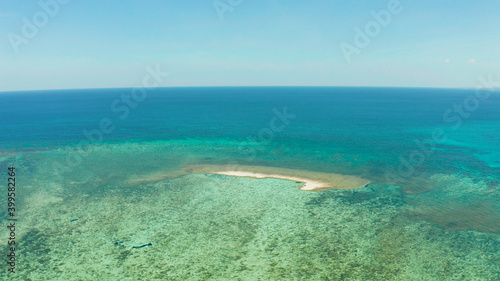 Seascape: Sandy bar, beach among coral reefs in turquoise atoll water, top view. Summer and travel vacation concept. Balabac, Palawan, Philippines.