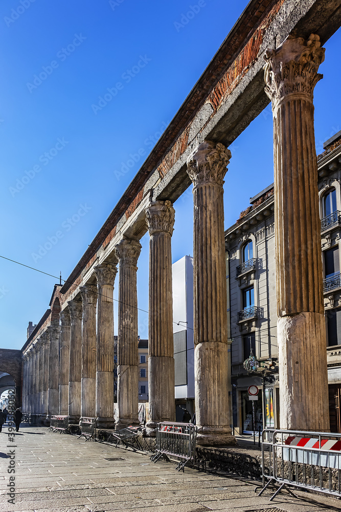 Best-known Roman ruin in Milan featuring 16 Corinthian marble columns (San Lorenzo Column, probably V century), located in front of Basilica of San Lorenzo Maggiore. Milan, Italy.