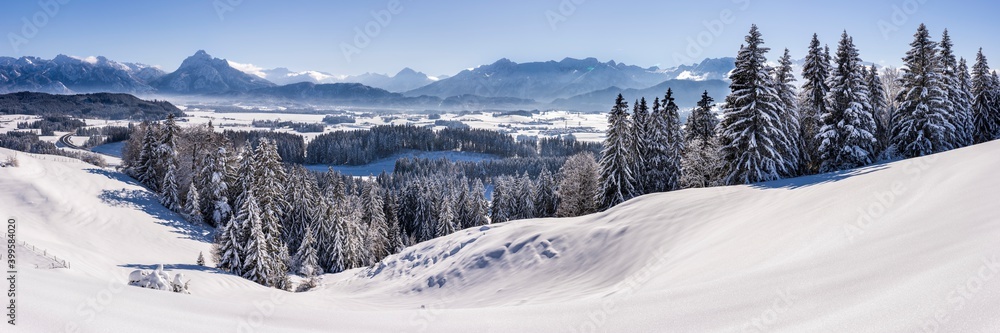 panoramic winter landscape in Germany, Bavaria, and alps mountain range
