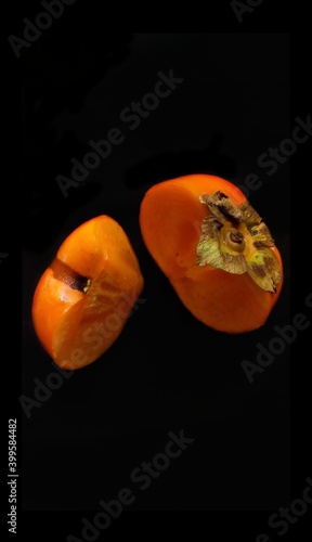 Persimmon on black background