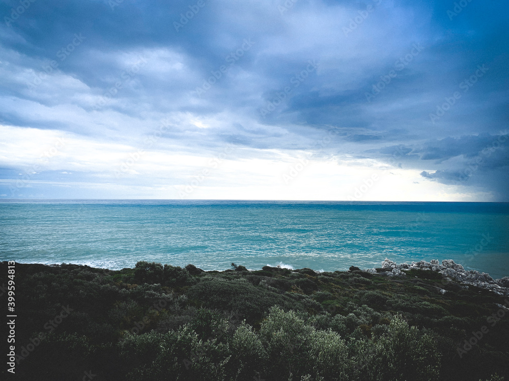 Stormy cloudy weather at the sea, azure water, seascape background Stormy cloudy weather at the sea, azure water, seascape background