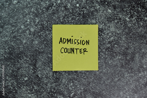 Admission Counter write on sticky notes on the table. Business concept