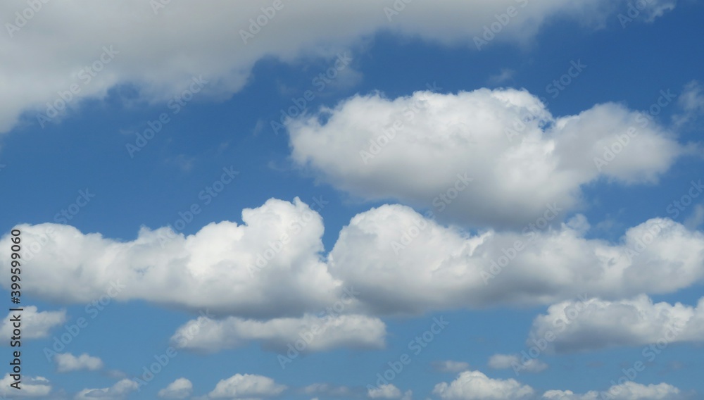 Panoramic view of blue sky with long fluffy clouds Panoramic view of blue sky with long fluffy clouds