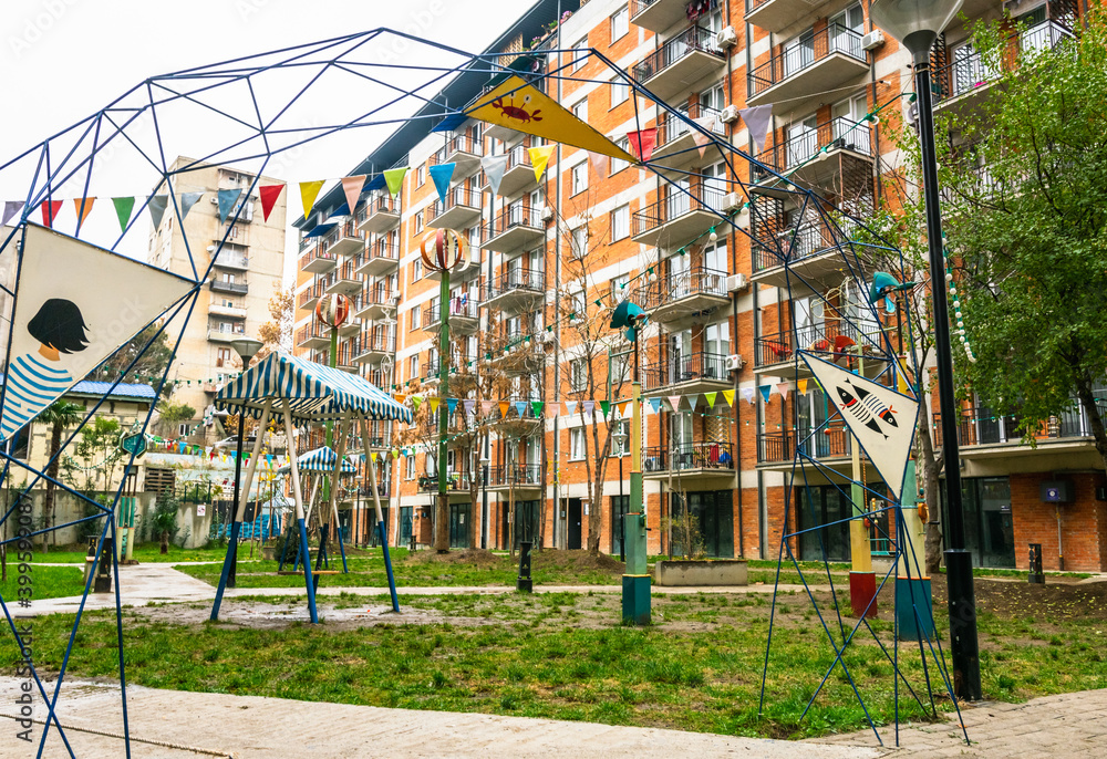 11th december, 2020. View to new modern houses in Saburtalo district with creative gorgeous yard and playground area. 11th december, 2020. View to new modern houses in Saburtalo district with creative gorgeous yard and playground area.
