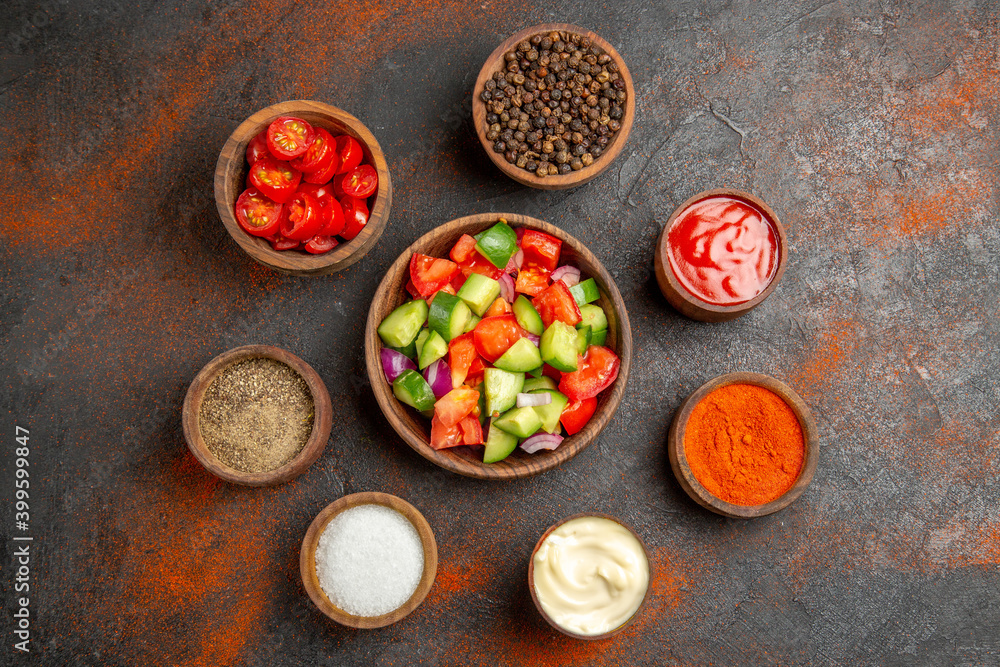 Overhea view of quick salad with tomato and cucumber and different flavors Overhea view of quick salad with tomato and cucumber and different flavors