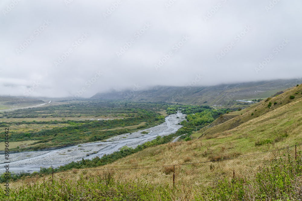 Cloudy view of ancient Alanian necropolis (the City of the Dead) of Dargavs village in North Osetia Alania, North Caucasus, Russia Cloudy view of ancient Alanian necropolis (the City of the Dead) of Dargavs village in North Osetia Alania, North Caucasus, Russia
