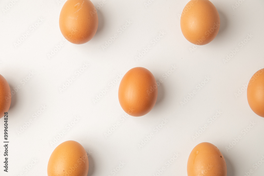 brown chicken eggs on color background