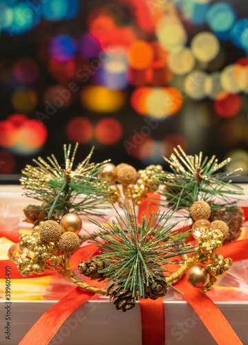 New Year's gift on the background of multi-colored blurred background. christmas present