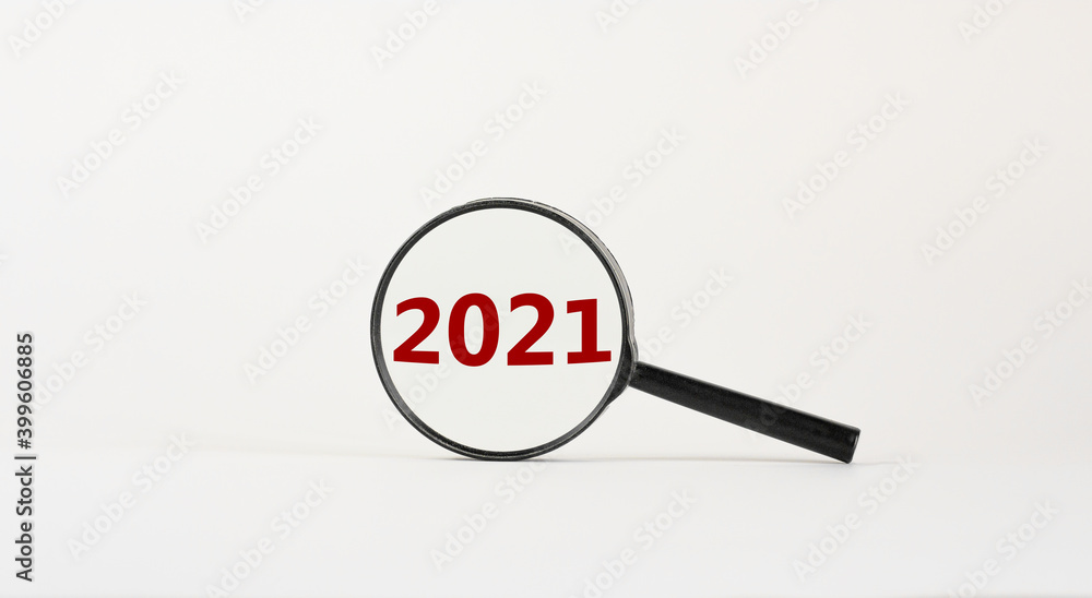 2021 new year symbol. Magnifying glass with number '2021' on beautiful white background. Business and 2021 new year concept, copy space. 2021 new year symbol. Magnifying glass with number '2021' on beautiful white background. Business and 2021 new year concept, copy space.