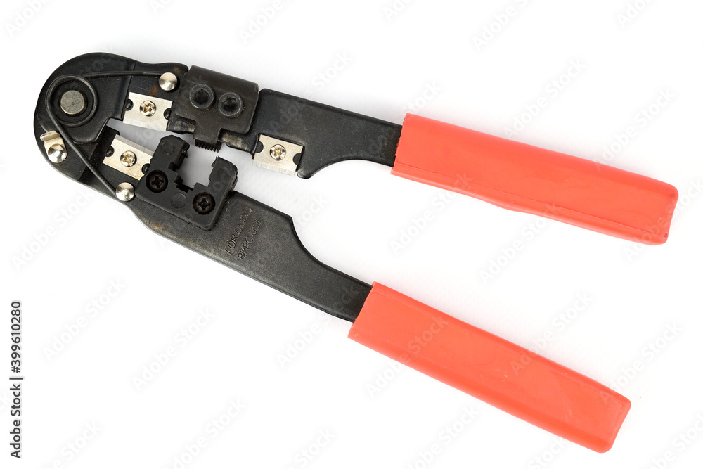Crimping tool for network wires with red plastic handles Crimping tool for network wires with red plastic handles